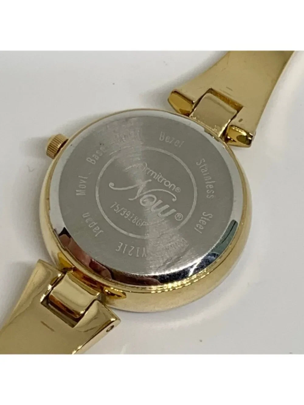 Armitron women’s watch gold tone 24mm mop dial quartz rhinestones running